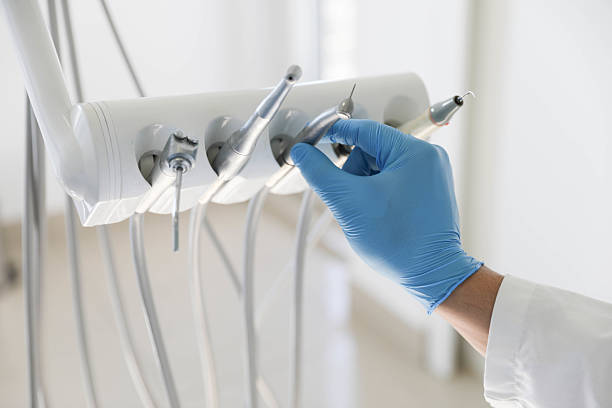 Professional Tooth Extraction technician working in Flat Rock, MI